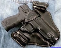 Custom holsters for concealed carry, lizard skin trim, full size pistol.